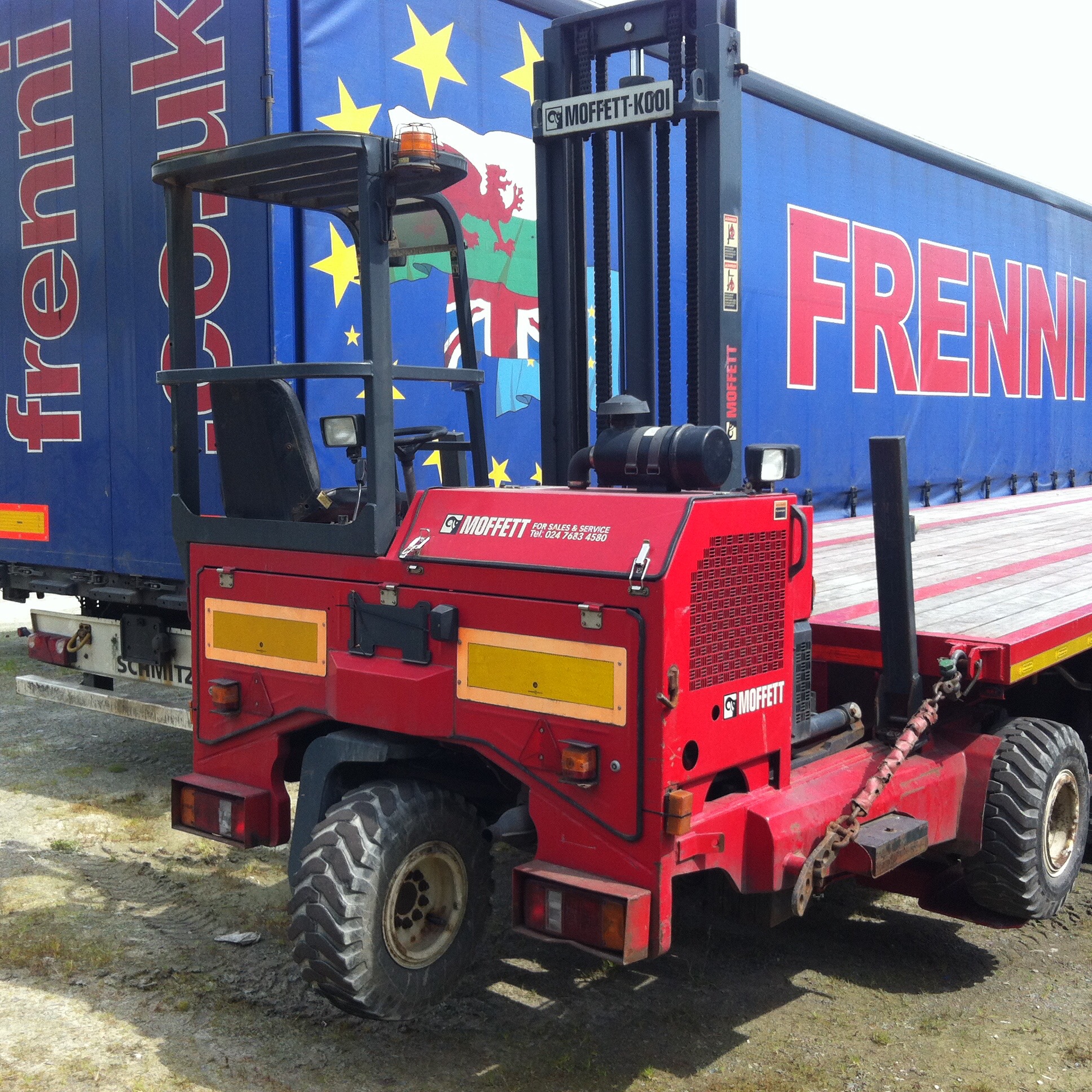 A frenni trailer and equipment at the yard