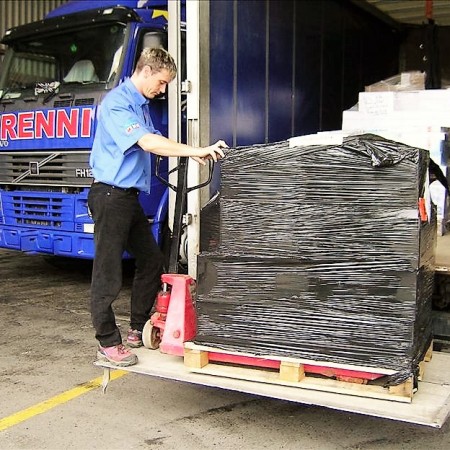 A wrapped pallet being loaded onto a frenni lorry